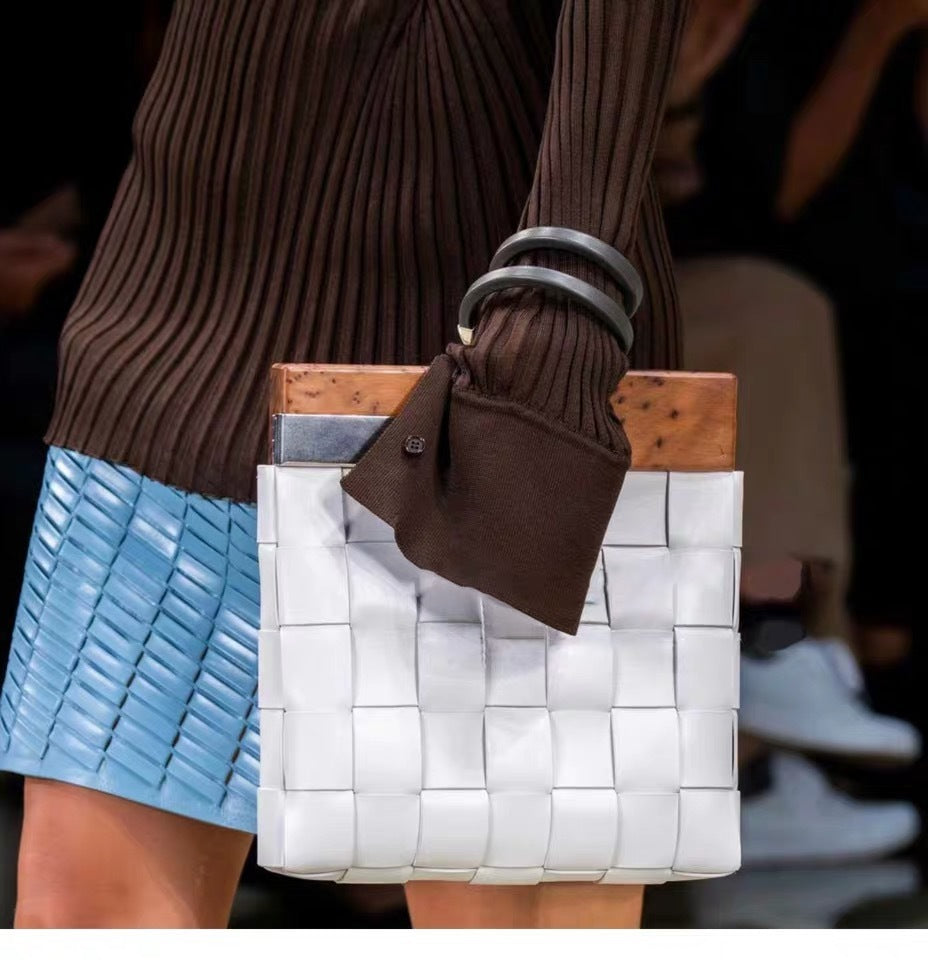 Hand bag woven with wooden handle