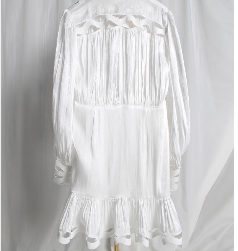 Korean version of the temperament solid color hollow wavy striped stand collar long-sleeved shirt fishtail dress