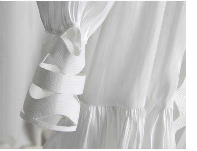 Korean version of the temperament solid color hollow wavy striped stand collar long-sleeved shirt fishtail dress